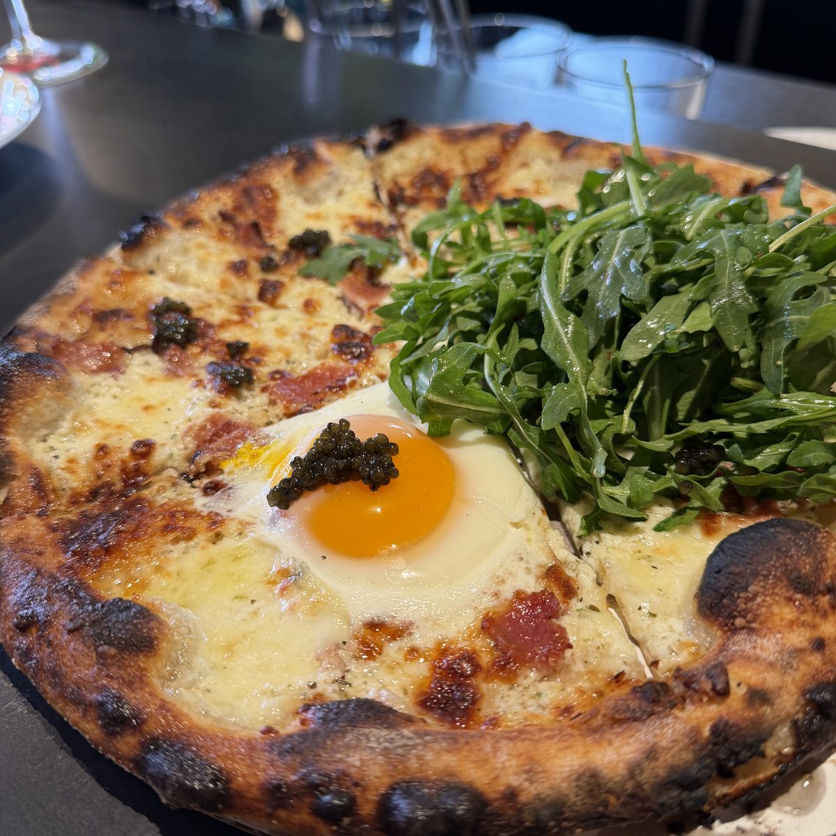 The Sunday Carbonara pizza with a fried egg and a caviar bump at Happy Valley Filling Station